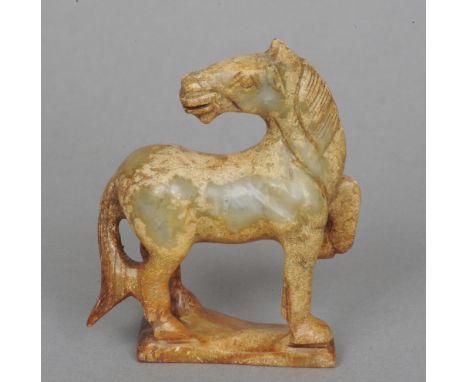 A Chinese carved jade type horse
In typical pose.  10 cm high. CONDITION REPORTS: Generally in good condition, expected wear.