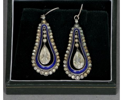 A pair of 19th century blue enamel and paste set white metal backed earrings
Pear shaped with central articulated drop.  5 cm