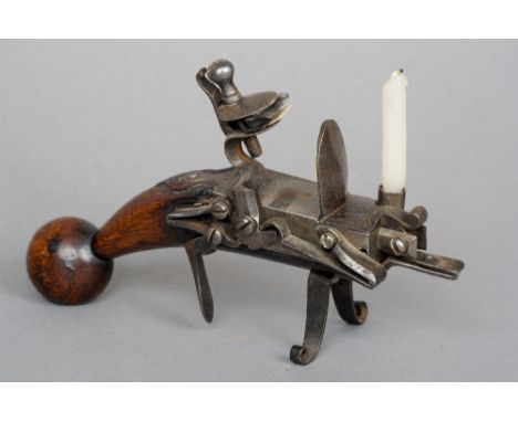 An 18th century tinder lighter
Typically modelled.  18 cm long. CONDITION REPORTS: Generally in good condition, expected wear