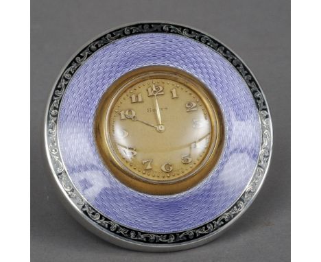 A George V enamel decorated silver mounted desk clock, hallmarked Birmingham 1923, maker's mark of HM
The circular body with 