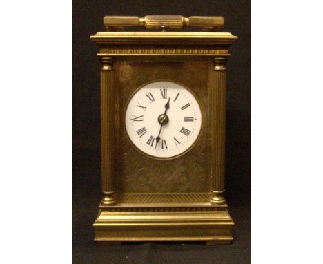 A brass cased repeating carriage clock by Charles Frodsham, London
The white enamelled dial with Roman numerals within a flor