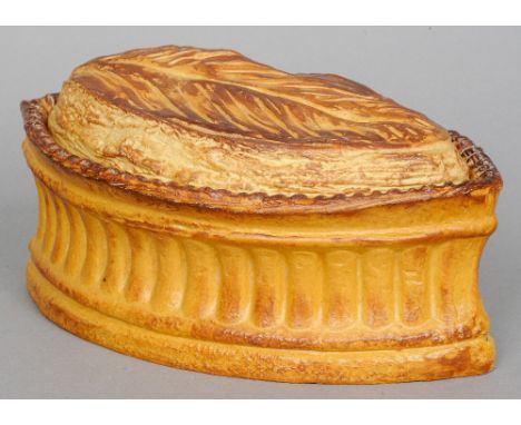 A late 19th century ceramic pie dish
The exterior decorated as pastry.  25 cm wide. CONDITION REPORTS: Some fritting/chipping