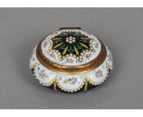A 19th century enamel decorated pill box
Of lobed circular form inset with small cabochon roundels.  5.5 cm wide. CONDITION R