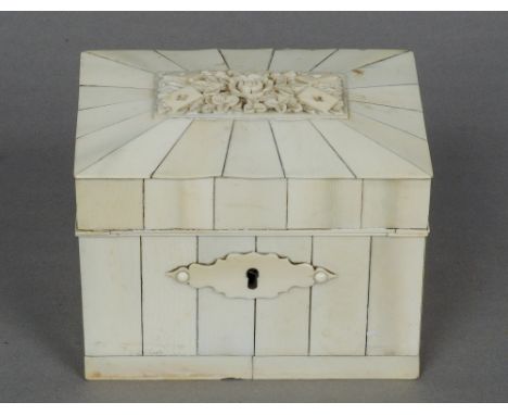 A Victorian ivory card box
The hinged domed lid carved with floral motifs and four playing cards, the interior with twin card