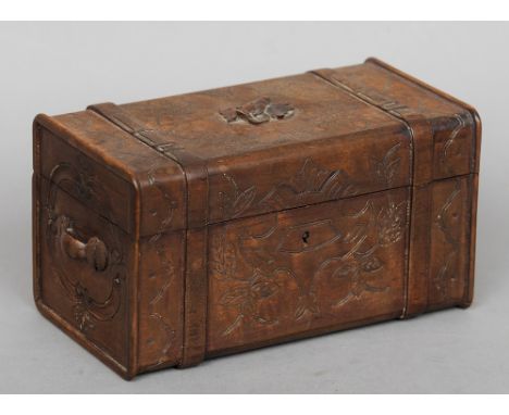 A 19th century Continental carved wooden box
Formed as a travelling trunk with floral decoration.  23.5 cms wide. CONDITION R