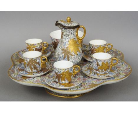 A Royal Worcester porcelain afternoon coffee set, including original Lazy Susan
Each piece decorated with brightly coloured f