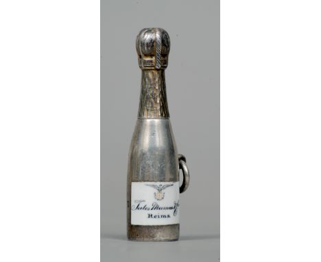 A Victorian novelty enamel decorated silver propelling pencil, hallmarks indistinct, maker's mark of TA
Formed as a bottle of