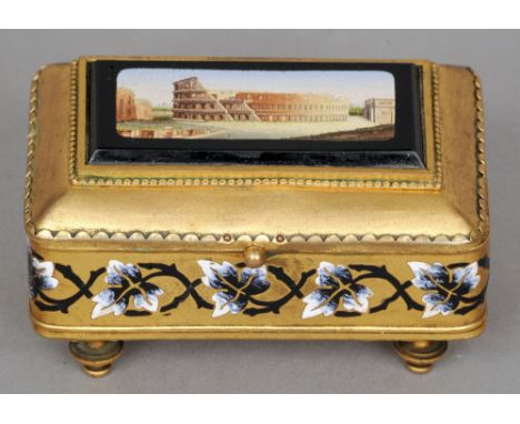 A 19th century micro-mosaic set and enamel decorated gilt metal box
The hinged cover with inset panel worked with the image o