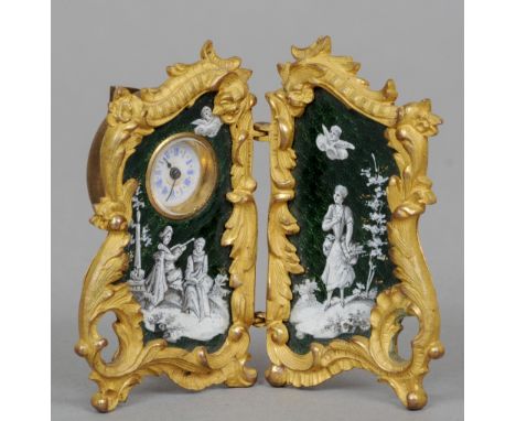 A 19th century Continental enamel decorated ormolu miniature desk clock
Of miniature twin section modesty screen form, the ci