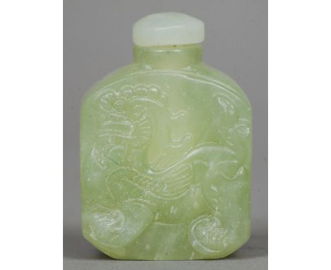 A Chinese carved jade snuff bottle and stopper
Worked with the figure of a dragon.  6 cms high. CONDITION REPORTS: Generally 