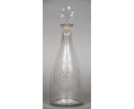 A 19th century engraved mallet form clear glass decanter
With two bow tied oval vignettes of various Masonic emblems.  30 cm 