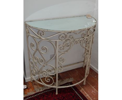 A 20th century wrought steel semi-circular console table, with a mirrored top, W. 90cm.