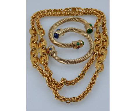 Celine. Paris. A gilt chain necklace, together with two gilt bangles set with blue, red and green cabuchon cut stones 