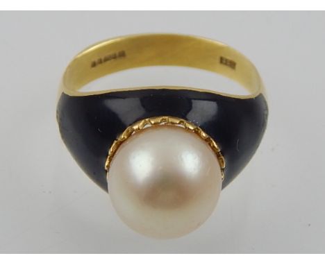 A cultured pearl dress ring, in black enamel, with 18ct yellow gold band. 