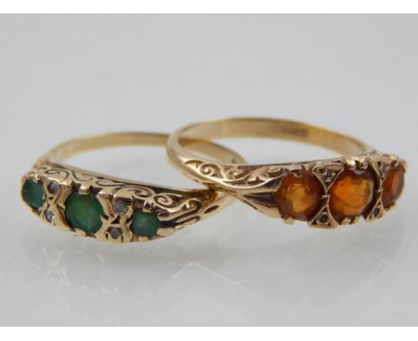 A 9 carat yellow gold and three stone emerald green, together with a 9 carat yellow gold and three stone fire opal ring. 