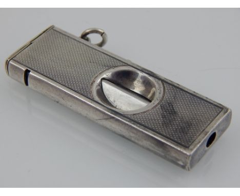 A Continental engine turned silver cigar cutter, marked MW and 925.