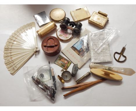 A quantity of collectibles to include ladies powder compacts, opera glasses, mother of pearl ivory page turner, glove stretch