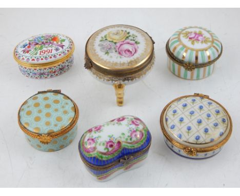 A Limoges circular enamel patch box gilt decorated on a turquoise ground together with two other Limoge ceramic / enamel boxe