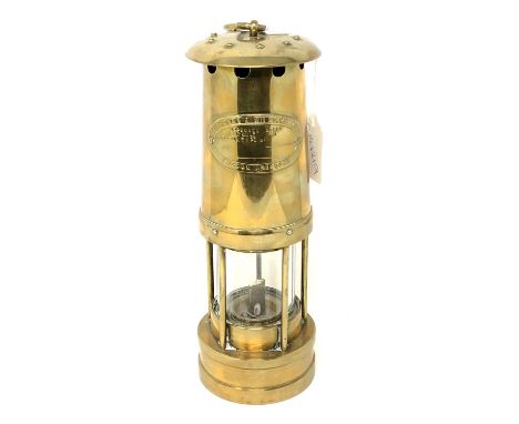 A brass miner's lamp by E Thomas &amp; Williams Ltd