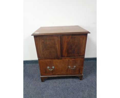 A Victorian inlaid mahogany commode chest 