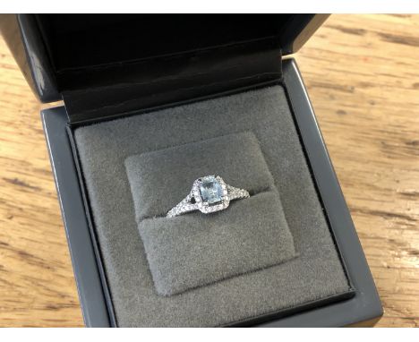 An 18ct white gold diamond and aquamarine ring, total diamond weight 0.20 carat, colour G, clarity SI1, with certification, s