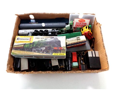 A box containing die cast and plastic rolling stock to include Kitmaster scale model, Airfix trains etc. 