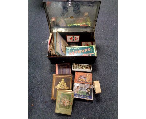 A tin trunk of 78's, vintage board games, child's bible etc 