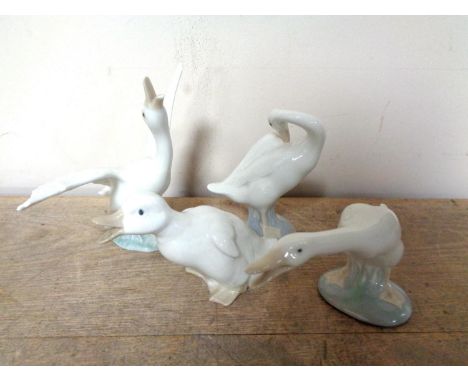 Three Lladro duck figure and a Nao duck figure 