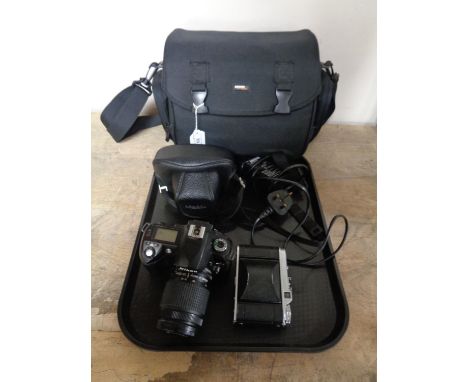 A camera bag of Pentax K1000 camera with 50 mm lens, Nikon D70 digital camera with lens, memory card, battery, charger, a Voi