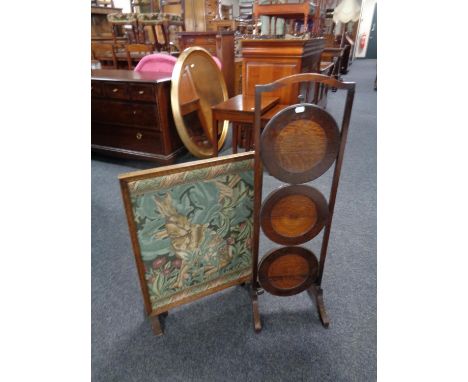 A three tier folding oak cake stand together with a folding tapestry fire screen table 