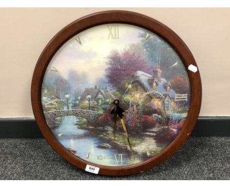After Thomas Kinkade (American, 1958-2012) : Lamp Light Bridge, a limited edition transitioning stained glass wall clock, lim