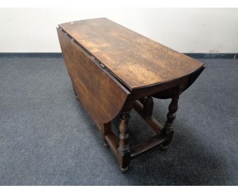 A 19th century oak gate leg table.   