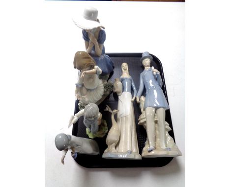 A tray of Nao figure of a lady seated in blue dress, together with a girl with two doves and four further Spanish figures (a/