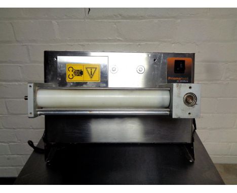 A Prisma Foods stainless steel commercial dough roller 