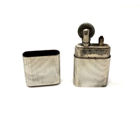 A silver 'The Howitt Lighter' with engine turned decoration, Sheffield 1946. 
