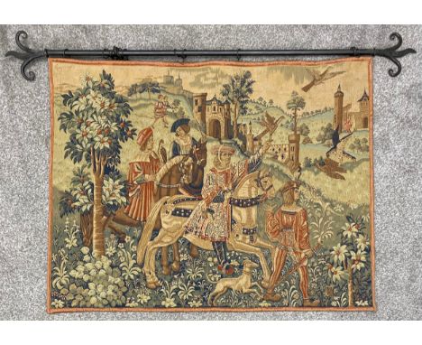 A medieval style wall hanging needlework tapestry with linen lining, a hunting scene on a cast iron rail with Fleur de Lys sp