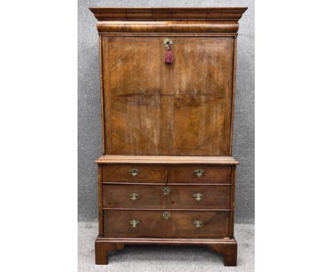A mid Georgian burr walnut and crossbanded escritoire with fall front revealing a fitted interior  above a base fitted with t