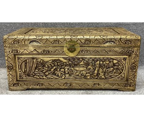 A vintage Chinese carved camphorwood coffer. H.40 W.89 D.44cm