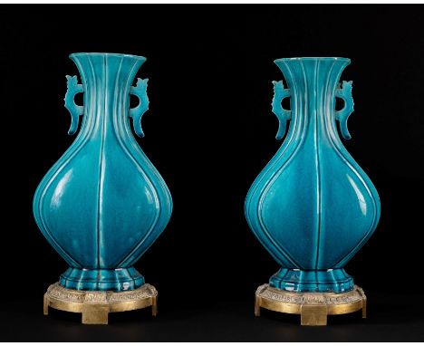 A pair of turquoise glazed vases, China, Kangxi Period (1661-1722)h cm 28 (pierced at the base)绿松石釉瓷双耳花瓶一对，中国，康熙时期（1661-1722）
