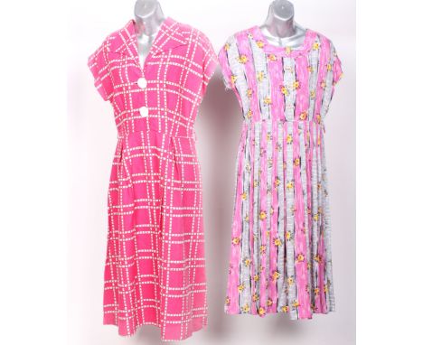 A 1940s blue crepe dress and belt; a Kerry Brooke late 1950s pink and white print dress, a 1960s pink satin full length eveni