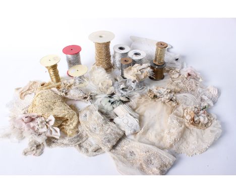 A collection of Cristina Eastwood headdresses constructed from antique lace and vintage millinery flowers;  spools of silver 