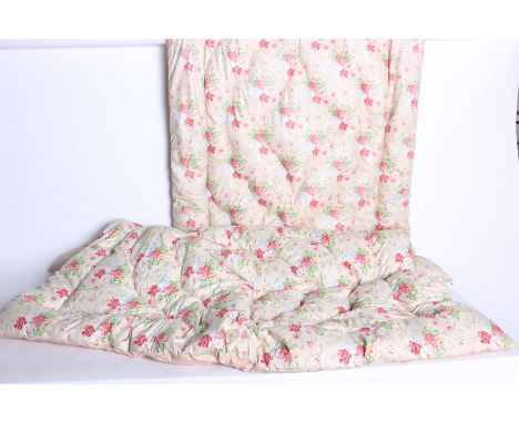 A 1930s floral patterned feather eiderdown, with a design of clusters of pink flowers on a pale green background and edged wi
