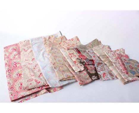 A collection of late 19th and early 20th Century English and French textiles, comprising paisley woollen shawl off cuts, prin