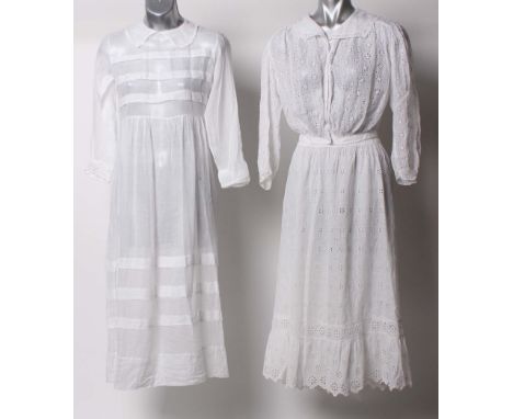 An early 20th Century white lawn cutwork long sleeved blouse; a white embroidered lawn skirt skirt with a wide frill to the h