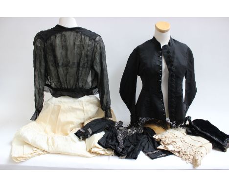 A late 19th Century black fitted boned jacket with covered buttons and lace trim; a 19th Century black silk velvet bonnet, a 