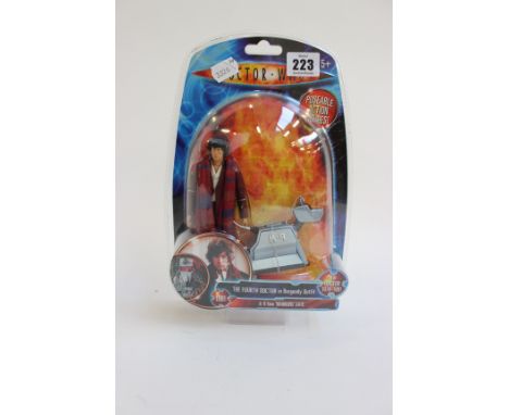 A Doctor Who Figure Set of Tom Baker as The Fourth Doctor in Burgundy Outfit and K-9 from ‘Warriors’ Gate’, unopened in box