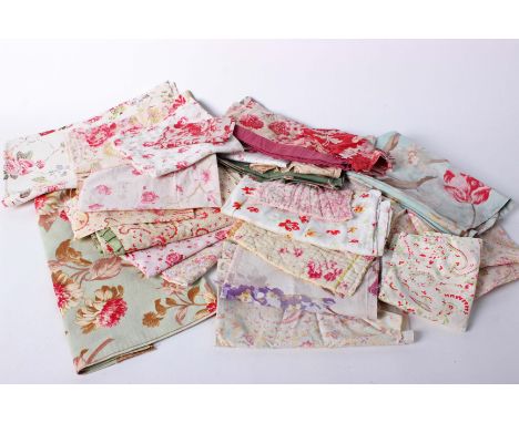 A collection of late 19th and early 20th Century quilted eiderdown pieces and scraps, English and French floral cotton fabric