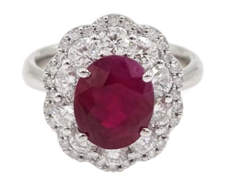 18ct white gold oval ruby and round brilliant cut diamond cluster ring, stamped 750, ruby 3.94 carat, total diamond weight 1.