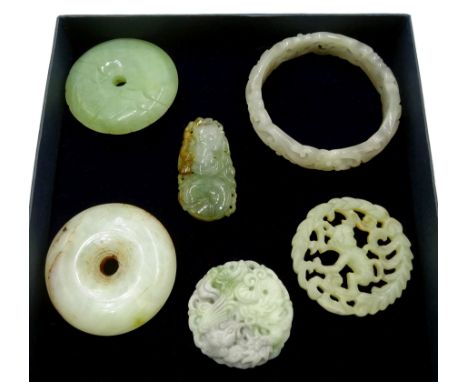Carved Hetian jade bangle, two carved jade pendants, two circular Celadon jade pendant's and one other  - Condition Report 