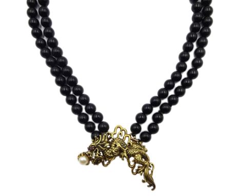 Franklin Mint 'Year of the Dragon' two strand black onyx necklace with detachable silver-gilt brooch set with a pearl and rub